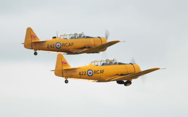 — — - 2 Harvards Taking Off