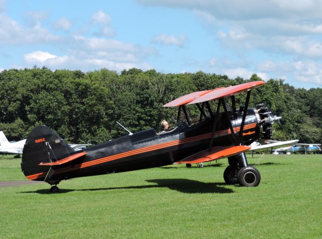 Piper PA-39 Twin Comanche CR (N89X) - This 1943 Bi Plane awaits its turn on the grass, summer of 2018.