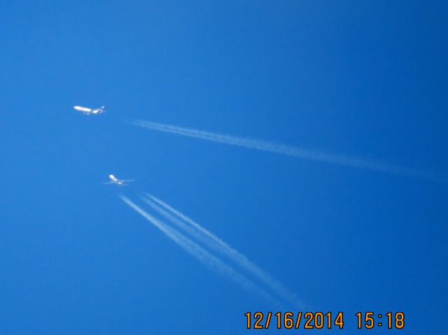 Boeing 747-400 (N477MC) - Atlas Air flight 2862 from SDF to PHX over Southeastern Kansas at 38,000 feet with a FedEx MD-11 passing in front.