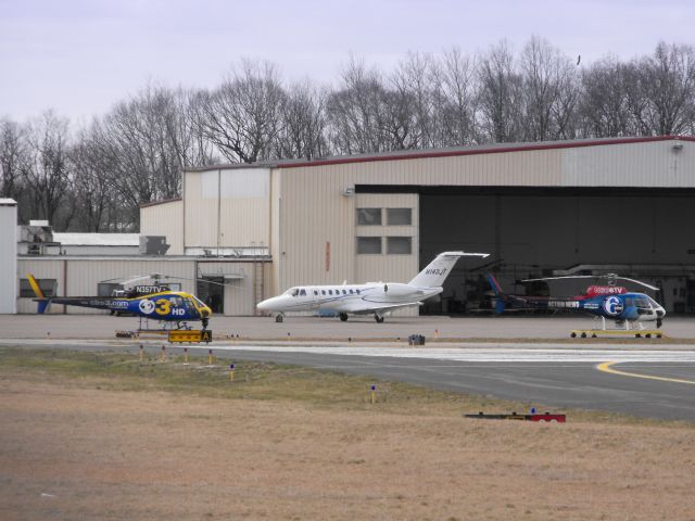 N143JT — - This Twin Engine Cessna Citation 525B Business Jet is enjoying some tarmac time while a pair of local network news Choppers wait for there next assignment. These Aircraft are shown here in the Spring of 2013.