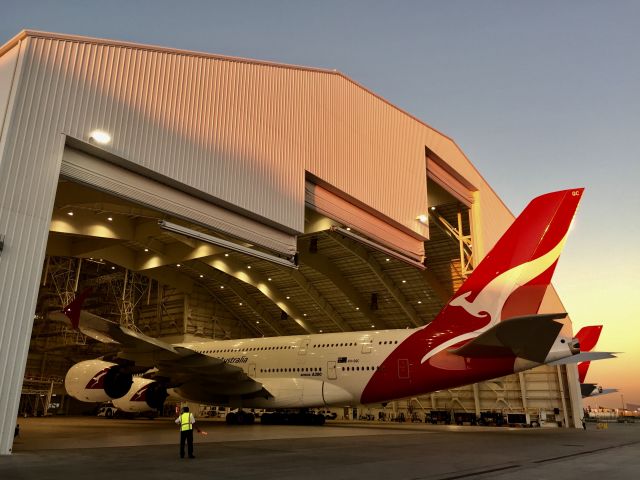 Airbus A380-800 (VH-OQC) - Pushing out of Qantas new hanger.   This is a replacement for the demolished TWA hanger.  It is located on the western most edge of the airport