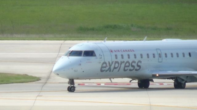 Canadair Regional Jet CRJ-100 (C-FWJI) - Turning off runway 5L.