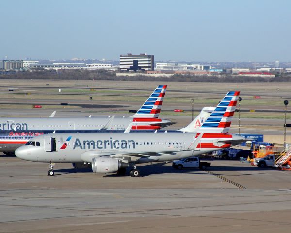 Airbus A319 (N9017P) - Awaiting its next flight at KDFW 2-23-17