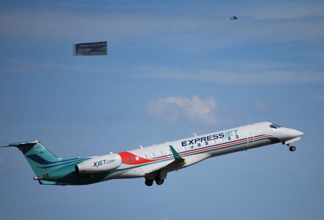 — — - Departing 20 headed for New Hampshire, with a banner plane flying over the ZMax Dragway in the background - 9/16/10