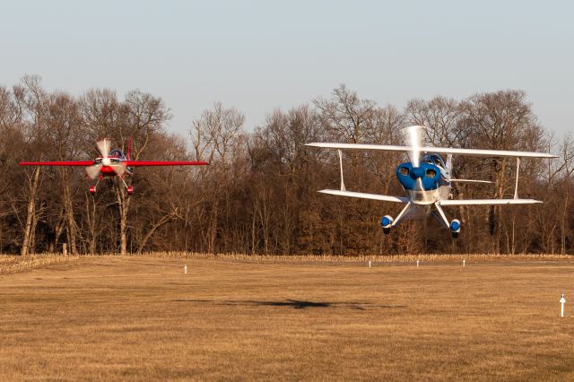 PITTS Special (S-1) (N76WN) - Corben and Renee performing a low pass for me in the Pitts and Extra 230. Low and fast!