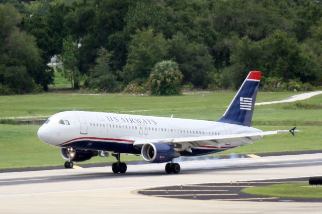 Airbus A320 (N119US) - US Air Flight 1241 (N119US) arrives on Runway 1R at Tampa International Airport following a flight from Philadelphia International Airport