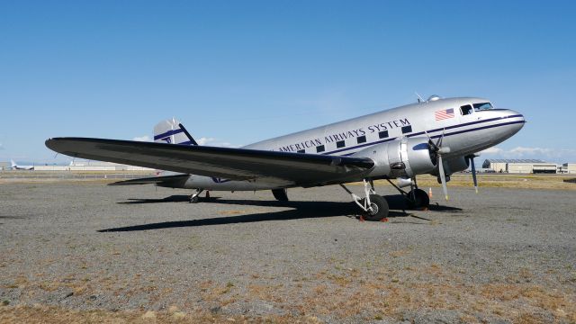 Douglas DC-3 (N877MG) - Historic Flight Foundations DC-3 (Ser#4193) awaits its next flight - 8/25/16.