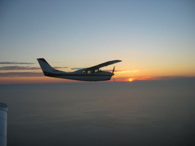 Cessna Centurion (VH-VVT) - Battle of Britain Dawn Patrol about 2009.  Over Port Philip Bay, Melbourne Australia.  Flying my Lance, VH-VVT the subject aircraft