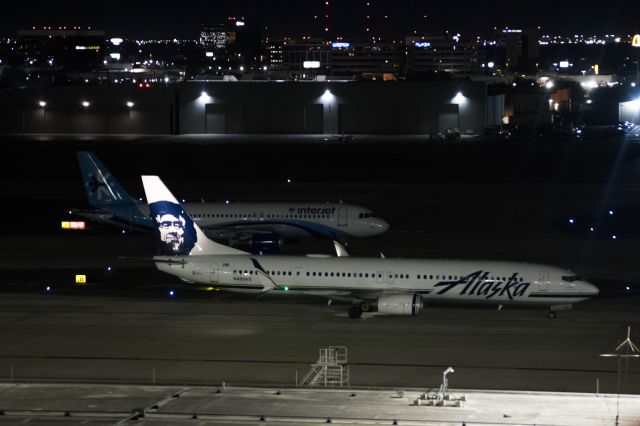 Boeing 737-900 (N491AS) - Getting ready to taxi to Runway 4 back to Seattle with a Interjet A320 anxiously waiting for the gate Alaska just left.