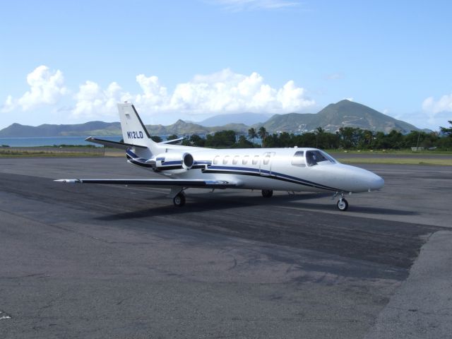 Cessna Citation II (N12LD) - Standing on the ramp in Nevis with St. Kitts in the background.