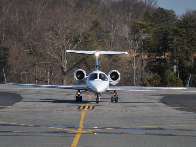 Learjet 31 (N47TR) - Taxiing (NFL Tennessee Titans QB, Kerry Collins) at KJQF - 3/4/09