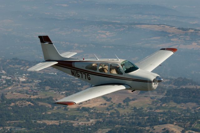 Beechcraft Bonanza (33) (N1577G) - Air to air photo (from the back of my Cherokee Six), Roger flying the Debonair, near to Newcastle CA.