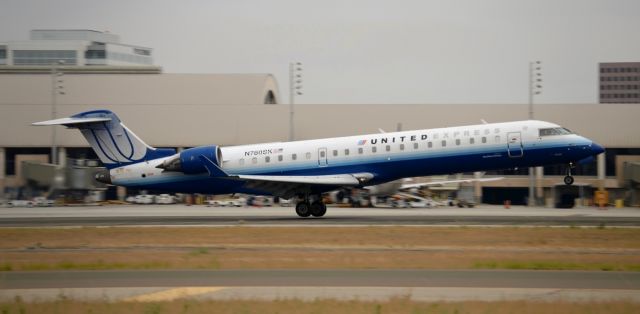 Canadair Regional Jet CRJ-700 (N760SK) - N760SK is seen right before it touches down at JWA. the next photo in this series had a good shot of the tire smoke, however the rest of the plane was blurry.