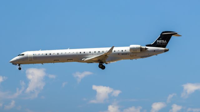 Canadair Regional Jet CRJ-900 (N920FJ) - Mesa Airlines CRJ-900 landing at PHX on 7/8/22. Taken with a Canon 850D and Rokinon 135mm f/2 lens.