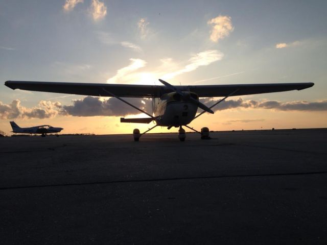 Cessna Skyhawk (N1417U) - MY PHOTO: COPYRIGHT GERALD HERBERT Setting sun at KNEW with my newly acquired C172M