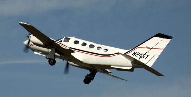 Cessna 421 (N245T) - Taking off to the East