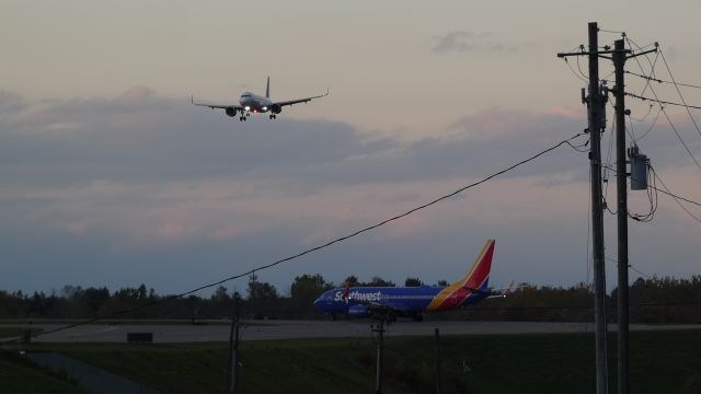 — — - Southwest 737 lining up and waiting while there’s a Frontier A320 landing on 23