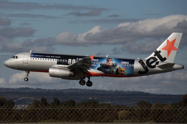 Airbus A320 (VH-VQM) - Jetstar Airbus A320 wearing the Buzz Lightyear landing at Adelaide airport from Brisbane.