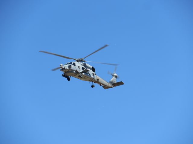 — — - This chopper did seven slow and go passes over our house (near the airport), even hovering for 30 seconds or so.