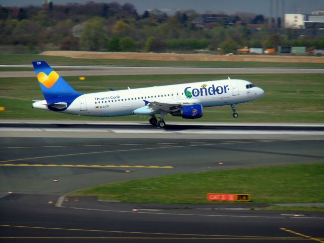 Airbus A320 (D-AICD) - Condor A320-200 D-AICD taking off from 05R DUS. Photo made 29.03.2014.