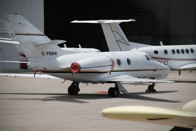 C-FBNW — - Flight Exec Falcon 10 C-FBNW, operates as flight # FEX11.  Buttonville Airport, (Toronto) July 4/08.