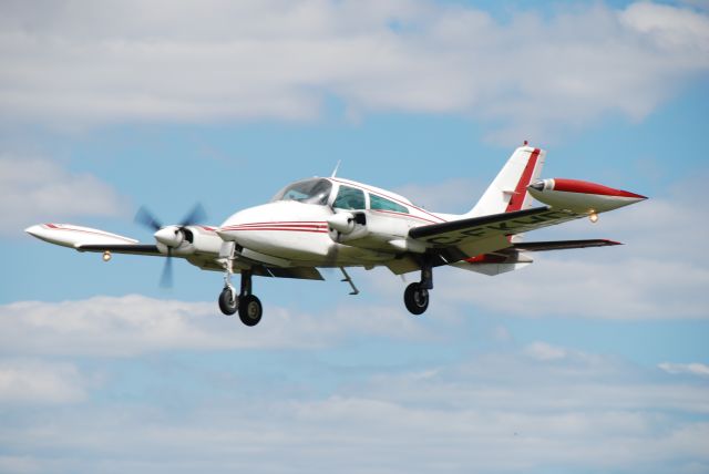 Cessna 310 (C-FKWD) - Landing at Torontos Buttonville Airport - a 1973 C310Q. April 18/10.