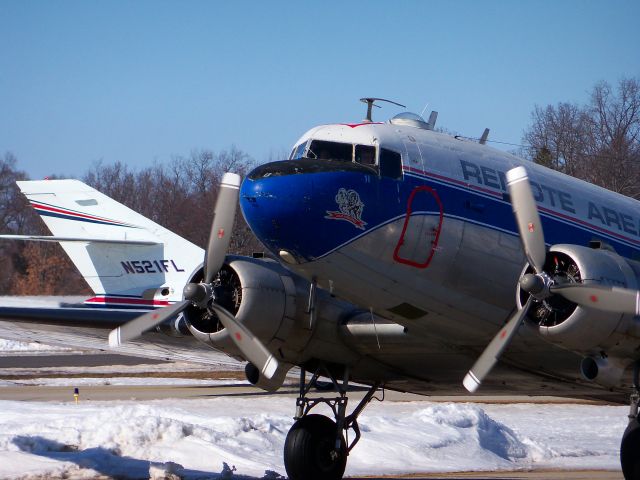 Douglas DC-3 (N982Z) - This beautiful DC3 was originally delivered in 1943 to the U.S. 9th Air Force. Now peacefully serving the needs of people afar, it is seen arriving at Oakland International Airport in Waterford, MI with a load of medical supplies for a Hati relief effort on a beautiful sunny day in March. March 5th 2010