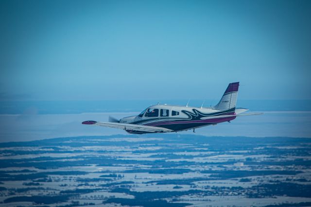Piper Cherokee (C-GRCP) - Flying with Lake Simcoe in the background
