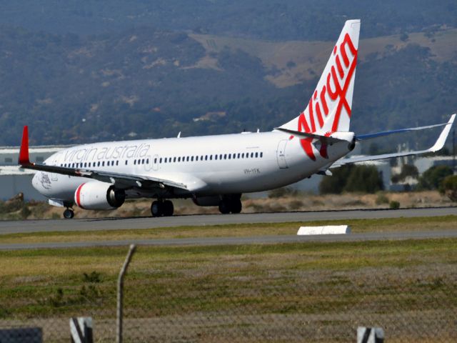 Boeing 737-800 (VH-YFK) - Turning on to runway 05 for take off. Thursday 12th April 2012.