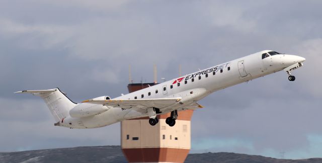 Embraer ERJ-145 (N844HK) - With the gear in transit to the wells, N844HK is just off 16R and on the climb enroute to Spokane International (KGEG).