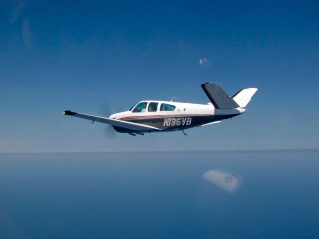 Beechcraft 35 Bonanza (N135VB) - Over Lake Michigan on the way to Oshkosh