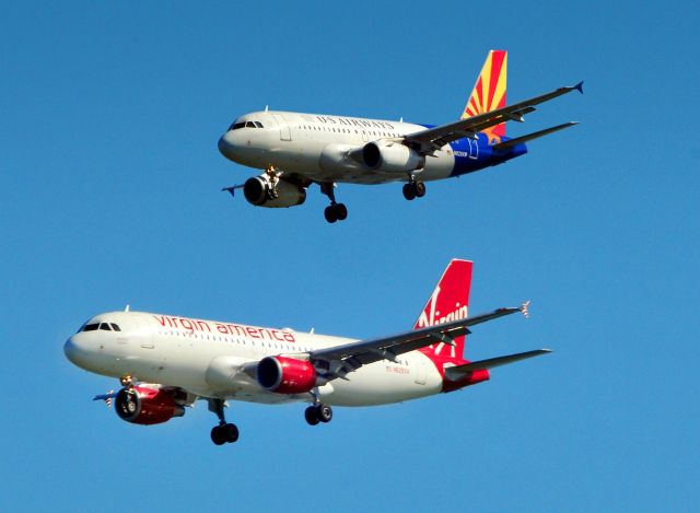 Airbus A320 (N625VA) - Virgin America on approach to 28R below as U.S. Airways join in for 28L a tandem approach at SFO.