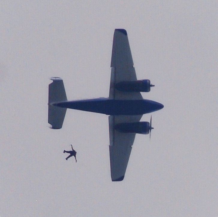 Beechcraft 18 (N502DD) - Perfectly timed picture of a skydiver exiting the plane at the Anderson Regional Airshow!