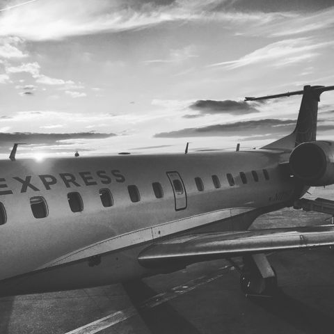 Embraer EMB-145XR (N12167) - United Express flight taken at sunset + converted to black + white / photo taken with an iPhone6s