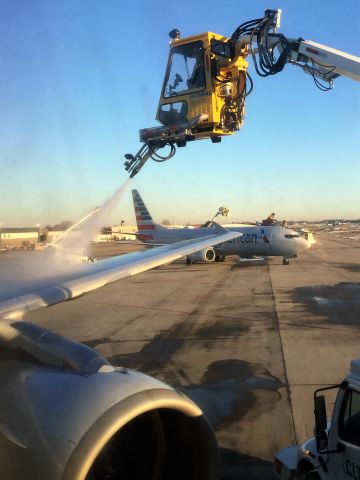 Airbus A321 (N188US) - Deicing operations in progress on this A321, heading from KCLT to a much warmer KFLL on December 11,2018. Flight: AA2064