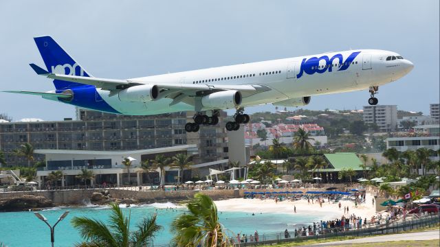 Airbus A340-300 (F-GLZP) - Joon flying for Air France Airbus A343 F-GLZP over maho beach for landing at TNCM St Maarten