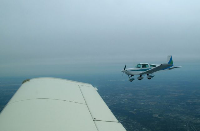 N28591 — - In formation with Grumman AA5B N28218. The aircraft is based at RELIANT AIR, where you find the lowest fuel price on the Danbury KDXR airport.