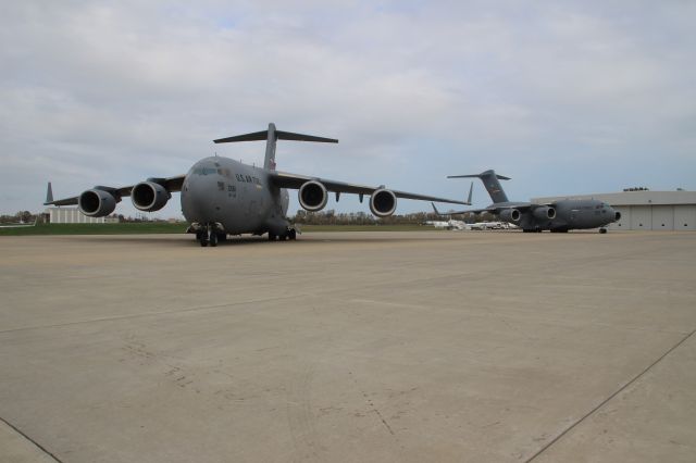 — — - A pair of C-17 "Heavies" sitting on west cargo ramp at Gary Regional Airport.