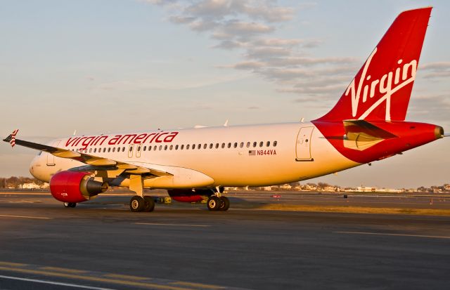 Airbus A320 (N844VA) - Sol Plane in the Winter Sun @ KBOS Logan