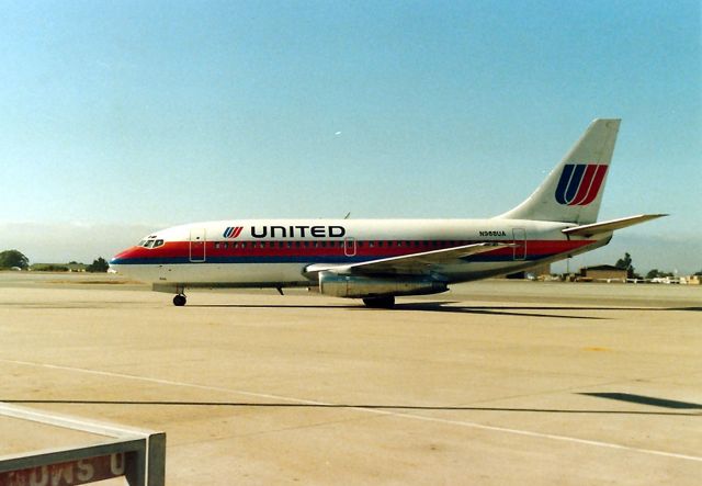 Boeing 737-200 (N988UA) - KMRY - 737 200 sits awaiting the next flight - photo taken 1989 or 1990. Note the ever present fog in the background. I have video of the UAL 727 action here in 1988 - awesome noise on take off.