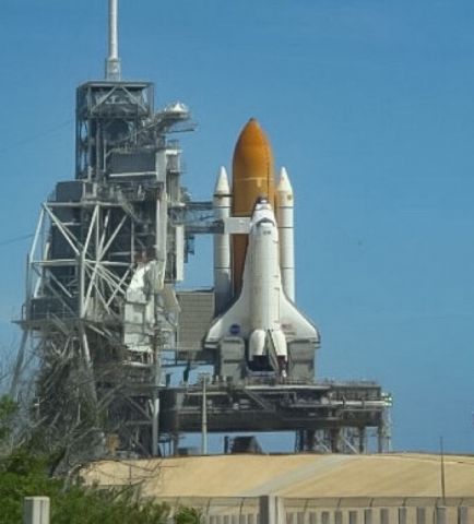 — — - Space Shuttle Atlantis poised for launch in April 2009.  I took this picture during the NASA employee open house.  No picture will do the justice of seeing the Shuttle Stack on the launch pad.  I sight that is truly missed!