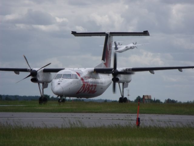 — — - A hub of dash-8 activity. A Porter taking off, and an Air Canada dhc-8 taxiing.