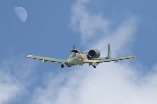 Fairchild-Republic Thunderbolt 2 — - This A-10 Warthog was performing at the 2022 Sun N Fun airshow in Lakeland, Florida. The moon had been visible all afternoon and after several aircraft came close to passing near the moon, I finally got the shot I was trying for. I also like how you can see the swirling exhaust gasses coming from the Warthog. I shot this with my 600mm Canon lens. Camera setting were 1/8000 shutter, F5.6, ISO 800. Please check out my other aviation photography. Votes and positive comments are always appreciated. Questions about this photo can be sent to Info@FlewShots.com