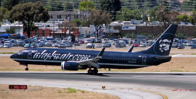 Boeing 737-800 (N548AS) - Flashback 2010  ~~br /ASA's excellent reverse-livery special paint on Runway 12R.br /Sadly, it turned out that this special paint was doomed and Alaska reversed the reverse livery to eliminate the two main disadvantages of it. But it sure 'nuff looked great!