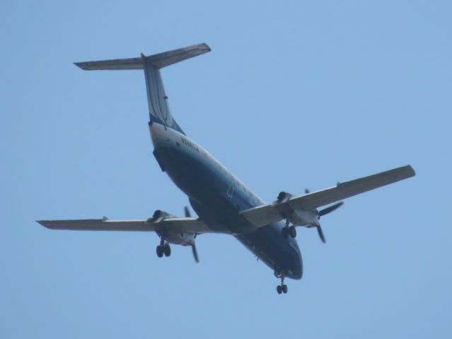 Embraer EMB-120 Brasilia (N568SW) - On final approach to SAN, seen over Balboa Park.