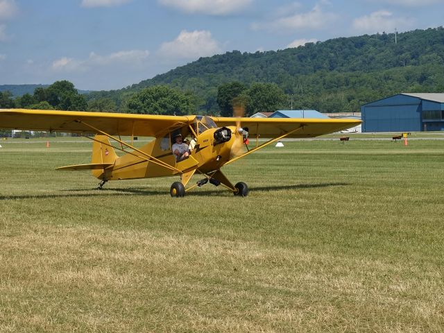 Piper NE Cub — - Taxiing to runway 27L at Lock Haven during the final day of Sentimental Journey 2016