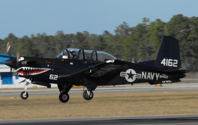 Beechcraft Mentor (16-4162) - "Devil 3" departing RWY 27 in Tallahassee. Thought the USN retired the T-34Cs?