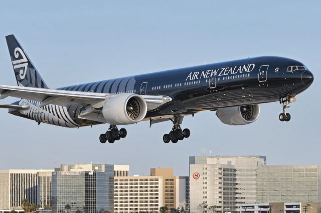 BOEING 777-300ER (ZK-OKQ) - An Air New Zealand operated Boeing 777-300 series widebody twin-jet in special "All Blacks" livery, moments from touch down at the Los Angeles International Airport, LAX, in Westchester, Los Angeles, California