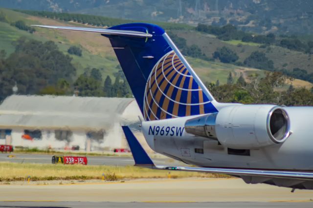 Canadair Regional Jet CRJ-200 (N969SW) - Taxiing into the stand in Santa Barbara this CRJ certainly seems to enjoy the sunshine