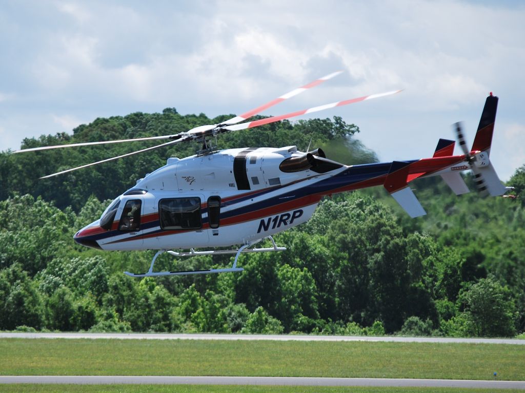 Bell 427 (N1RP) - PENSKE CORP (former NASCAR driver Rusty Wallaces helo N2RW) departing on taxiway Alpha to the north at KJQF - 5/24/13 (now re-registered as N50RP - NASCAR team owner Roger Penske)